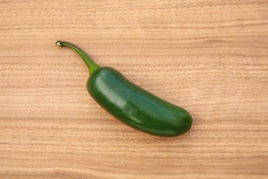 Fresh green jalapeno pepper on wooden table, top view