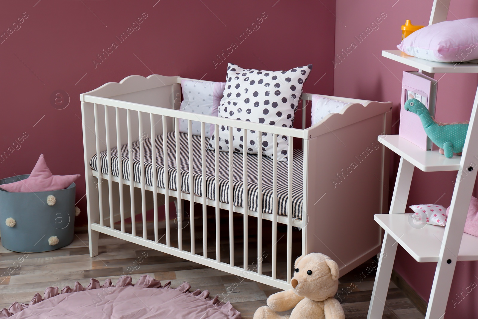 Photo of Stylish baby room interior with crib