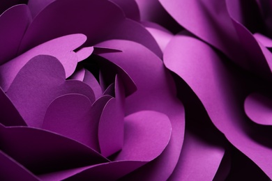 Photo of Beautiful purple flowers made of paper as background, closeup