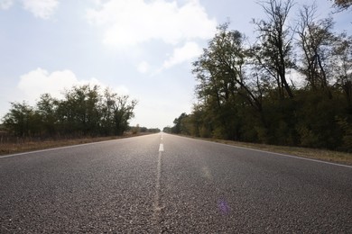 Photo of View of asphalt road without transport in countryside