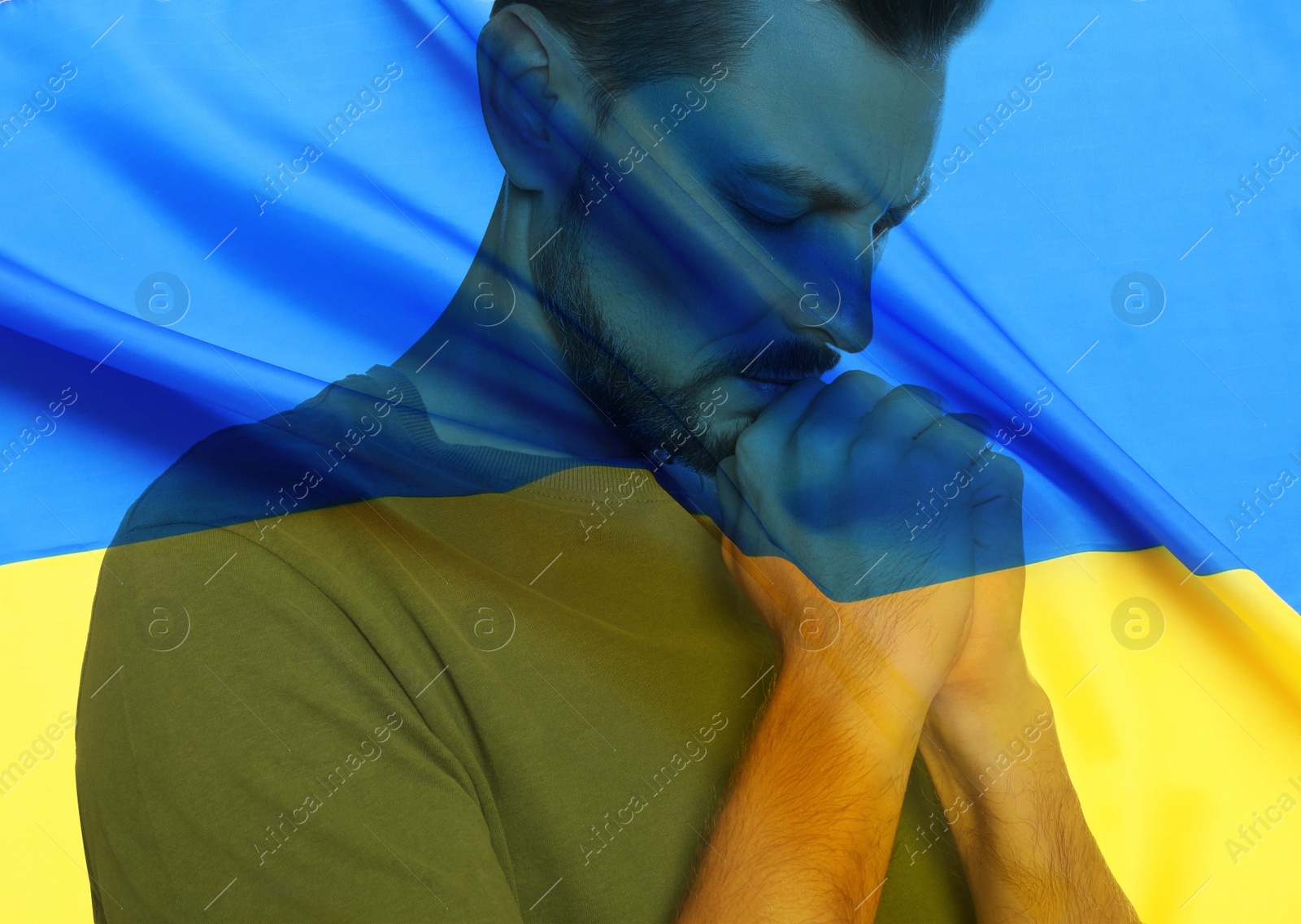 Image of Double exposure of national flag and man praying. Stop war in Ukraine