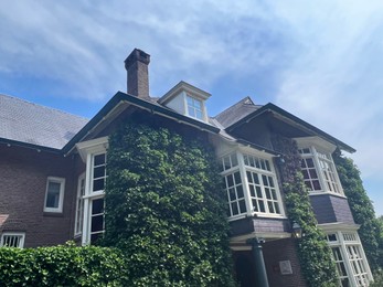 Picturesque view of beautiful house and plants on sunny day