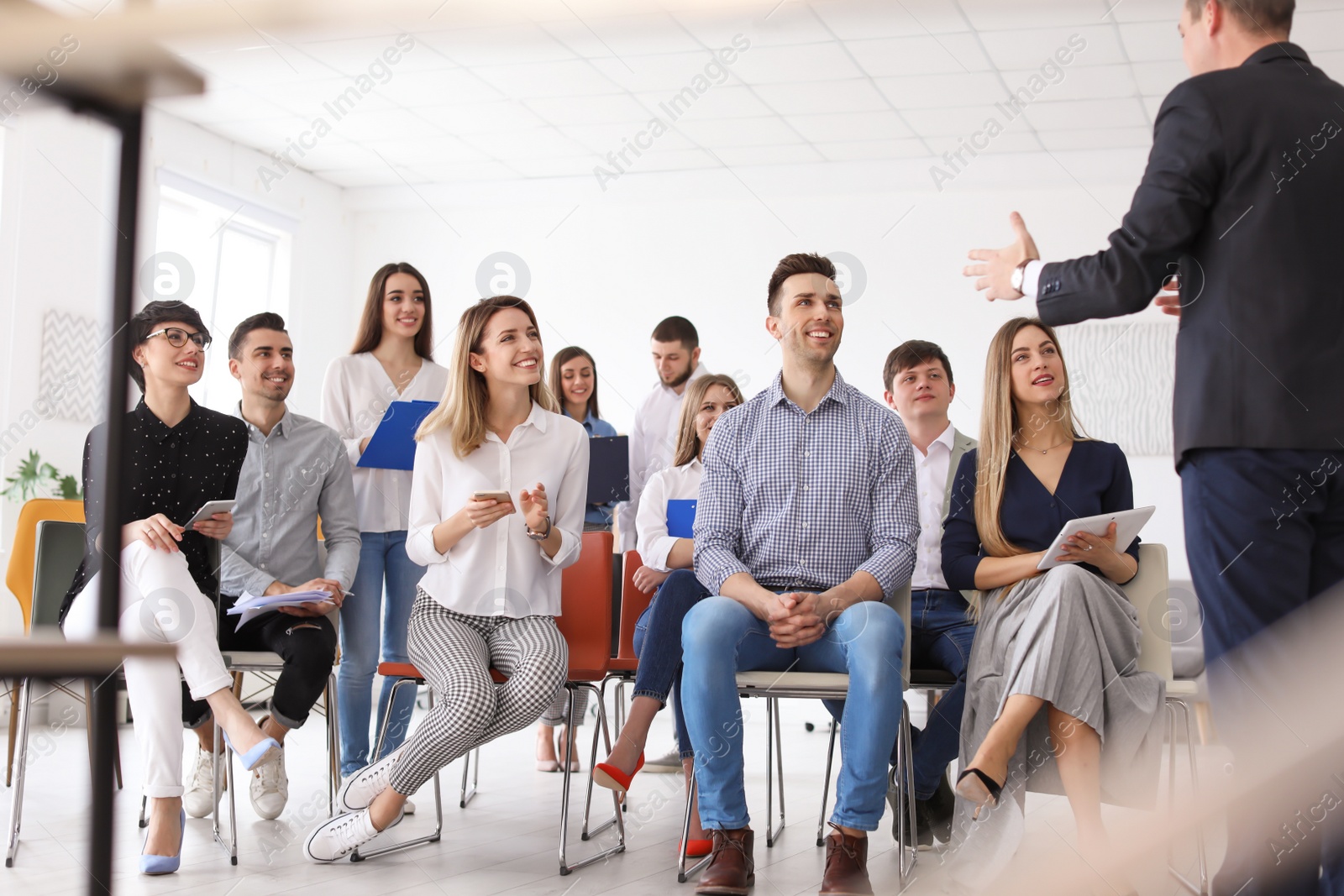 Photo of Male business trainer giving lecture in office