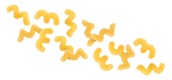Raw cavatappi pasta falling on white background