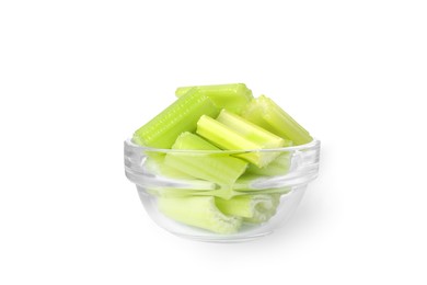 Photo of Glass bowl of fresh cut celery isolated on white