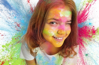 Image of Holi festival celebration. Happy teen girl covered with colorful powder dyes on white background