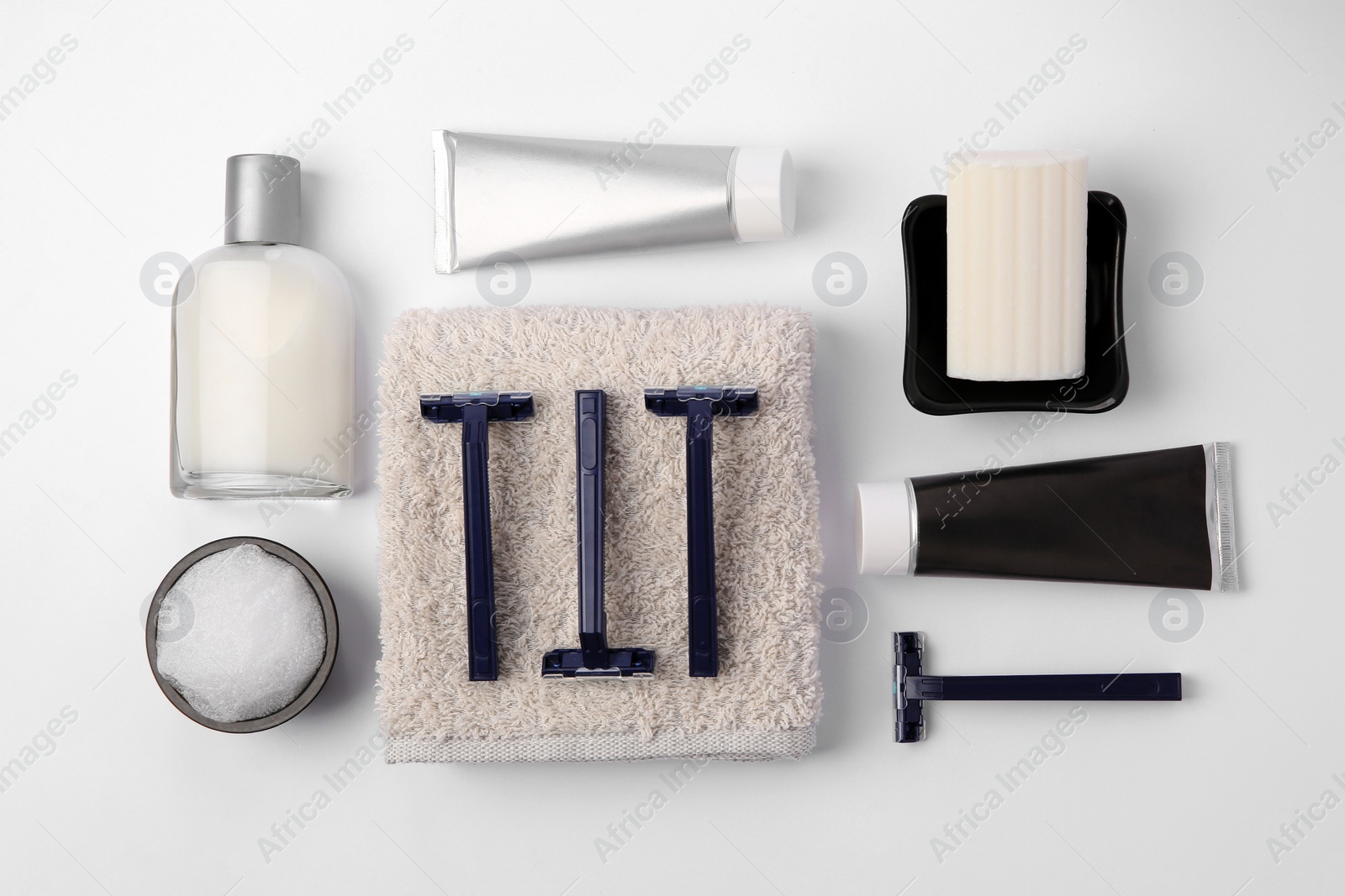 Photo of Different men's shaving accessories on white background, flat lay