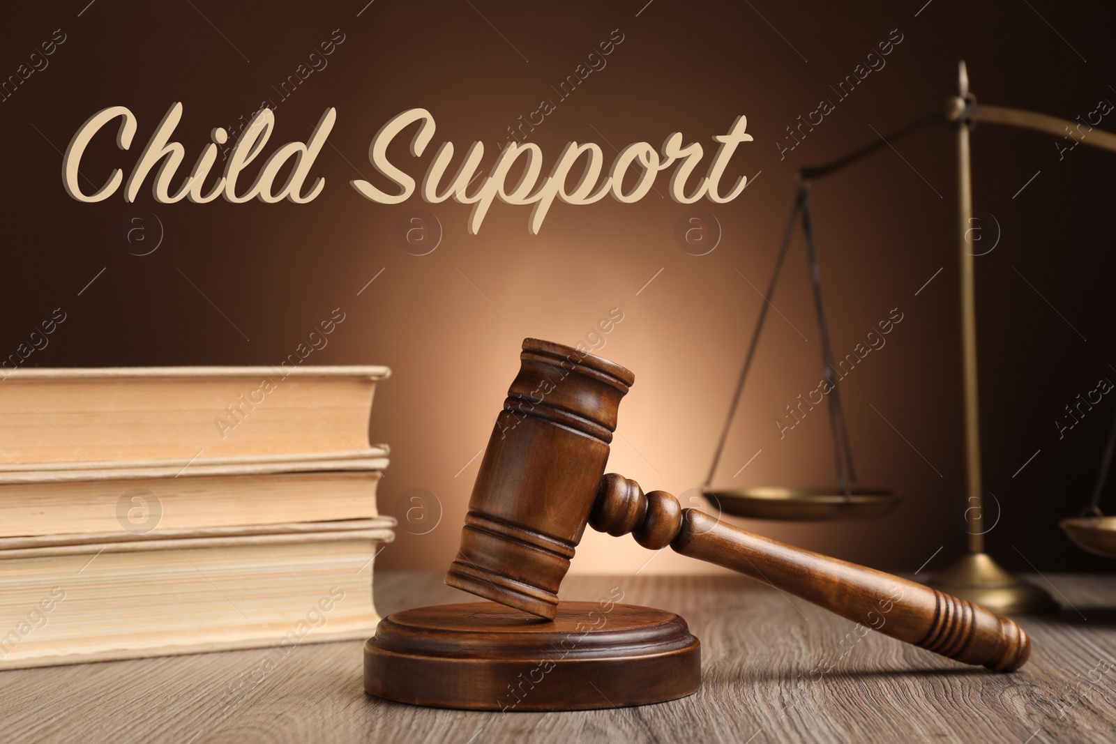 Image of Judge's gavel, scales of justice and books on wooden table. Child support concept