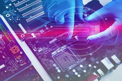 Image of Technician repairing computer motherboard, closeup. Electronic device