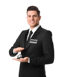 Happy receptionist in uniform holding service bell on white background