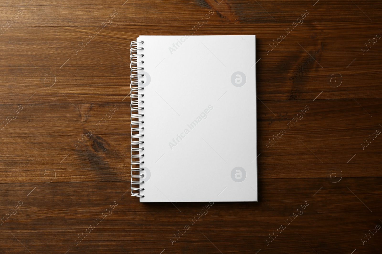 Photo of Blank paper brochure on wooden table, top view. Mockup for design