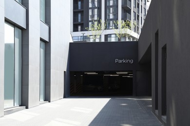 Photo of Parking garage with metal gate in modern building