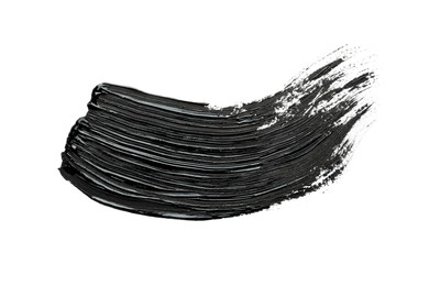 Brushstrokes of black oil paint on white background, top view