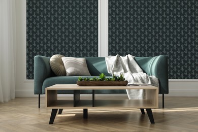 Image of Comfortable teal sofa and side table near wall. Minimalist living room interior