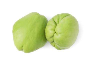 Photo of Two fresh green chayote isolated on white, top view