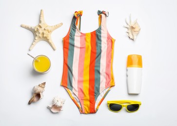 Flat lay composition with beach objects on white background