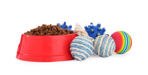 Photo of Different toys and bowl of food for pet isolated on white