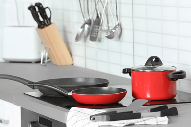 Different clean cookware and utensils in kitchen