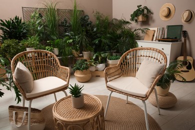 Photo of Room interior with stylish furniture and different houseplants