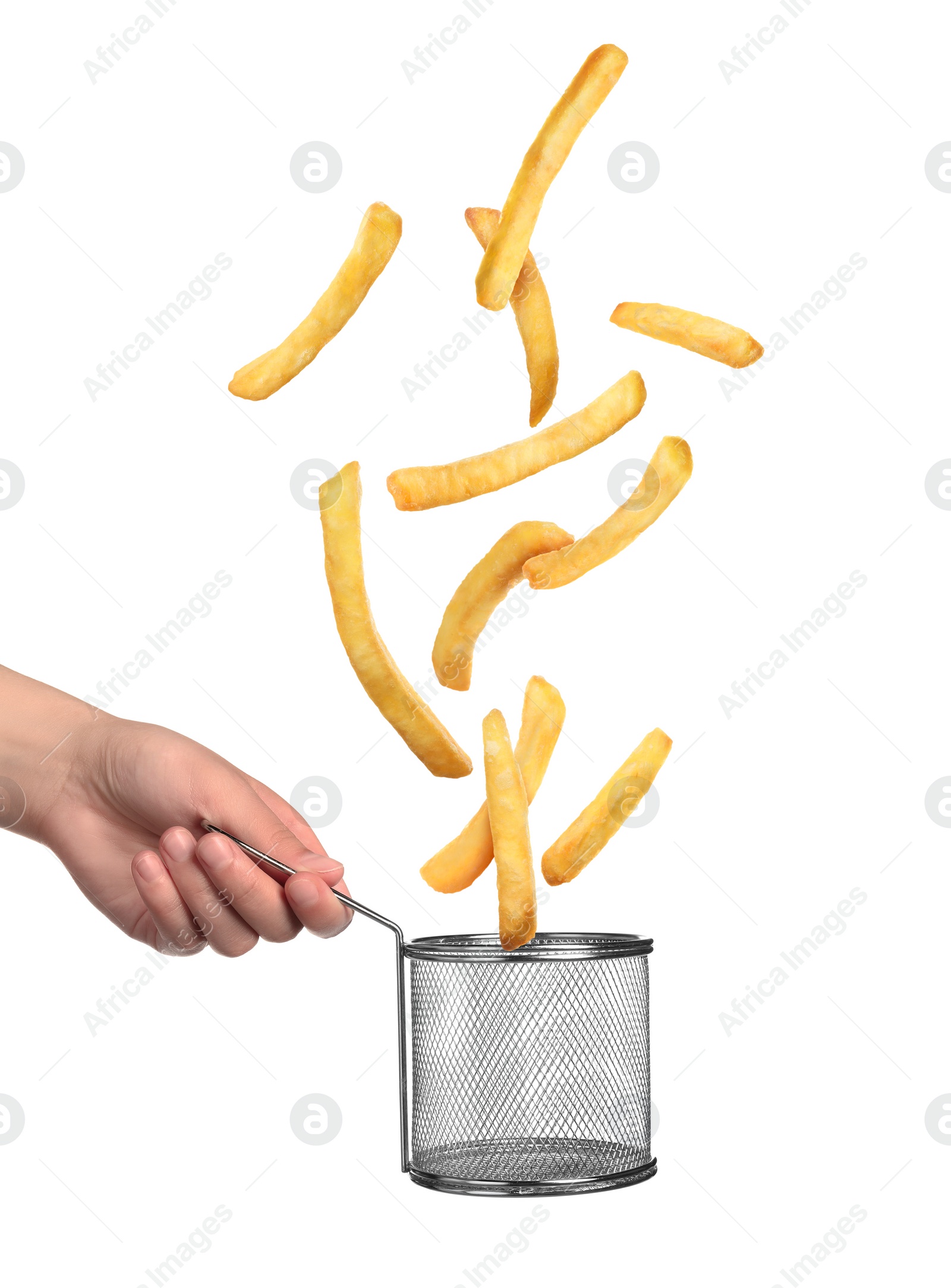 Image of French fries falling into metal basket held by woman on white background, closeup