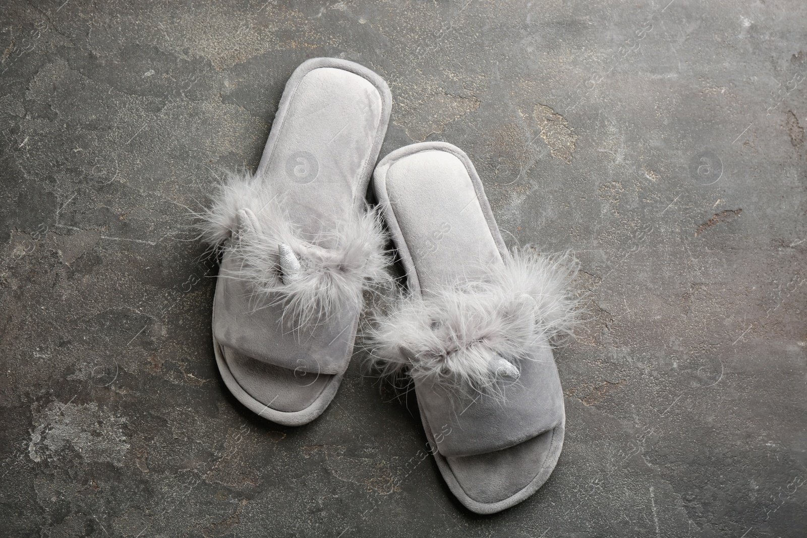 Photo of Pair of stylish soft slippers on grey background, flat lay