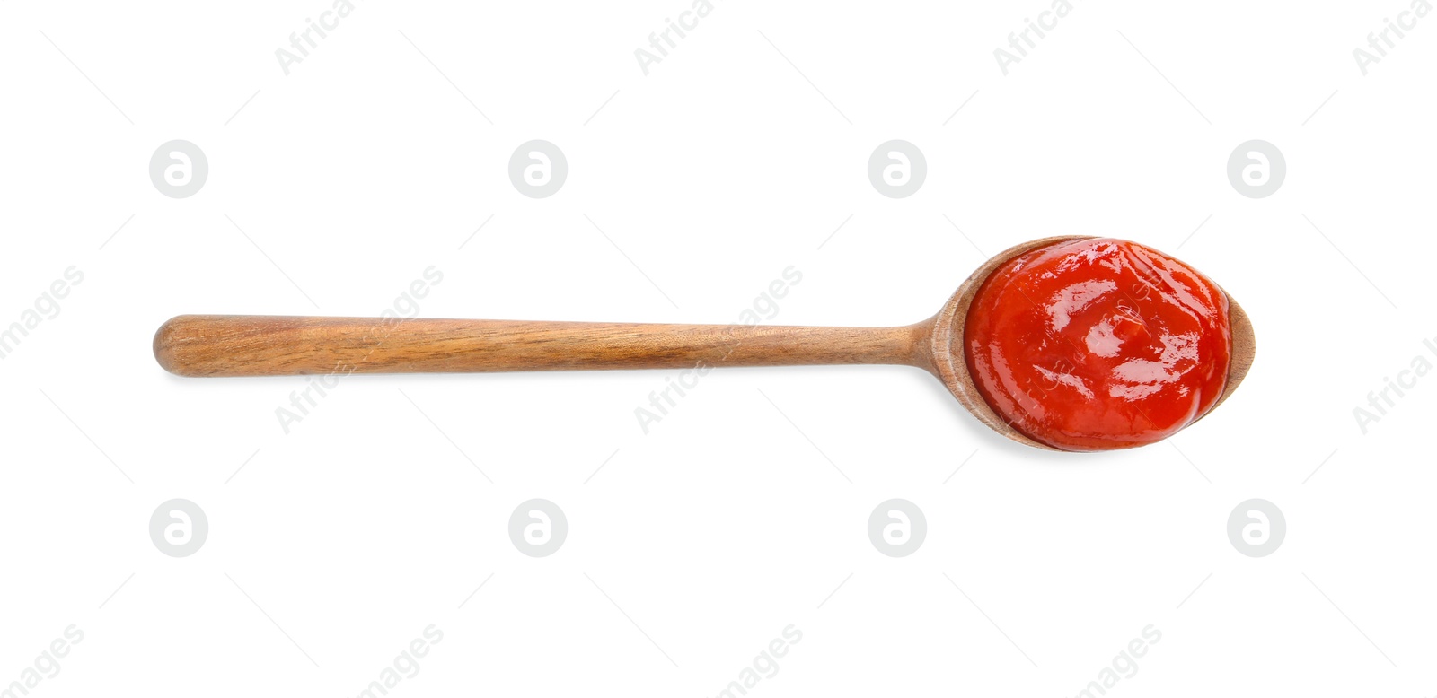 Photo of Tasty ketchup with wooden spoon isolated on white, top view. Tomato sauce