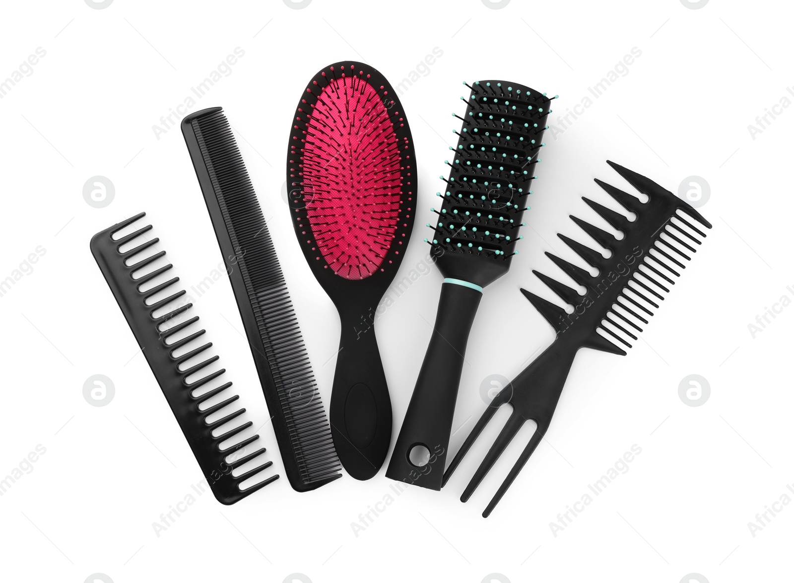 Photo of Set of hair brushes and combs isolated on white, top view