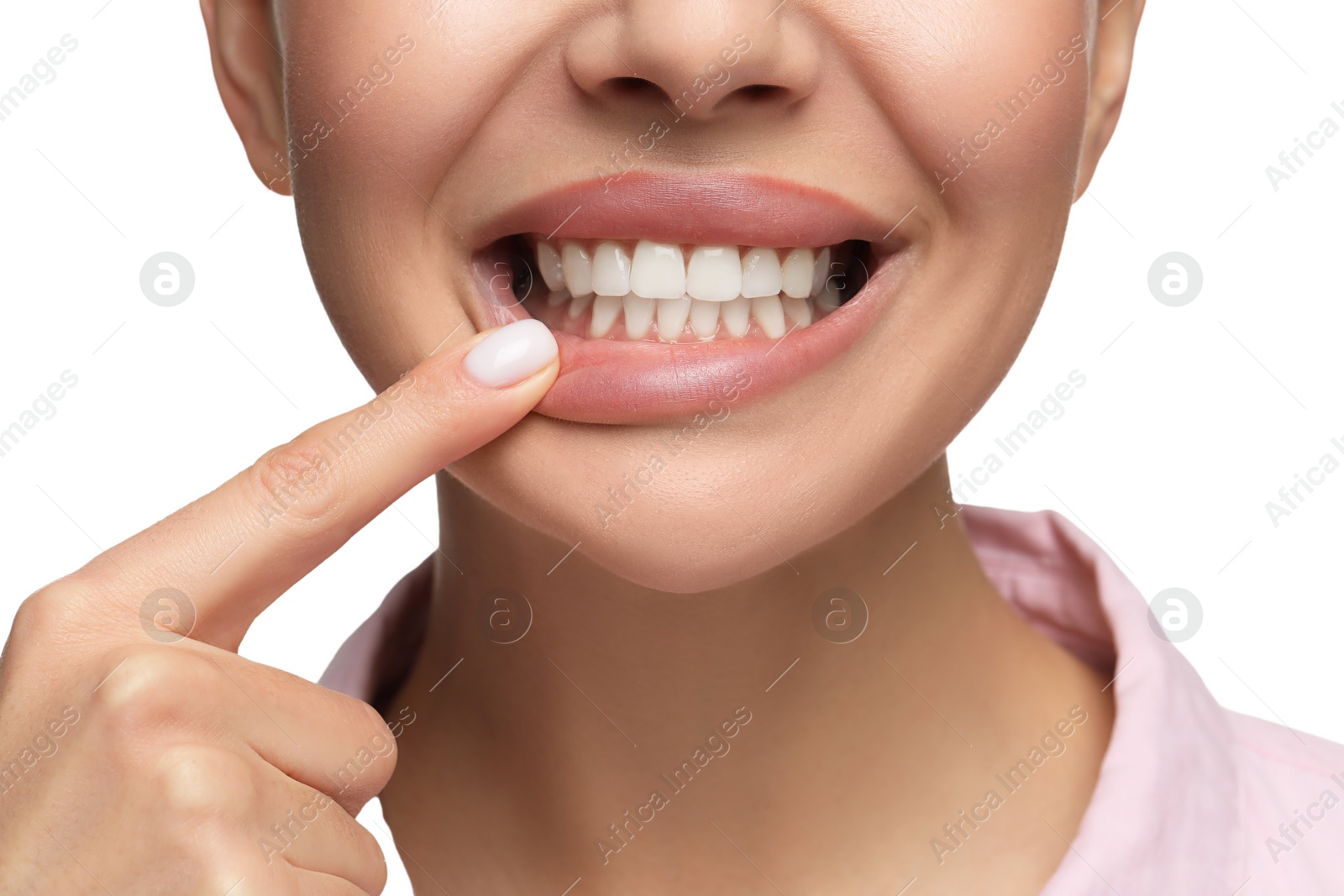 Photo of Woman showing her clean teeth on white background, closeup