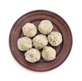 Plate with tasty fresh khinkali (dumplings) and spices isolated on white, top view. Georgian cuisine