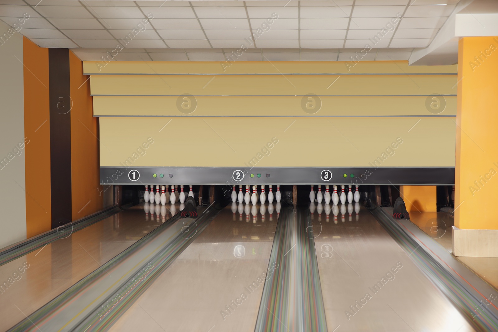 Photo of Bowling alley lanes with pins in club