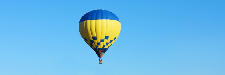Image of Hot air balloon in blue sky. Banner design 