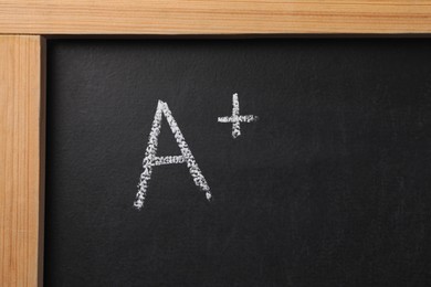 School grade. Letter A with plus symbol on blackboard, top view