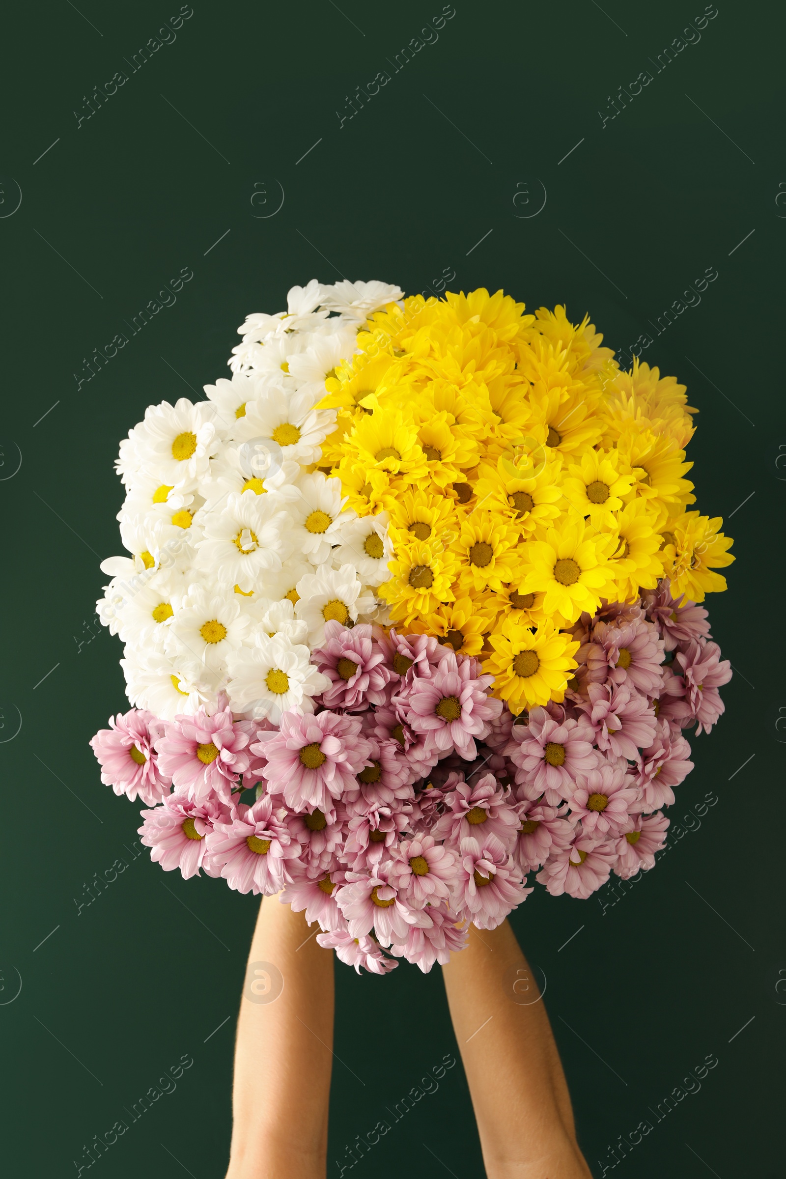 Photo of Woman holding beautiful bouquet near green chalkboard. Happy Teacher's Day