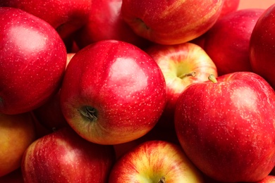 Pile of ripe red apples as background, closeup