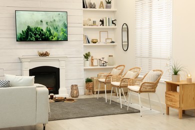 Photo of Cozy living room interior with decorative fireplace