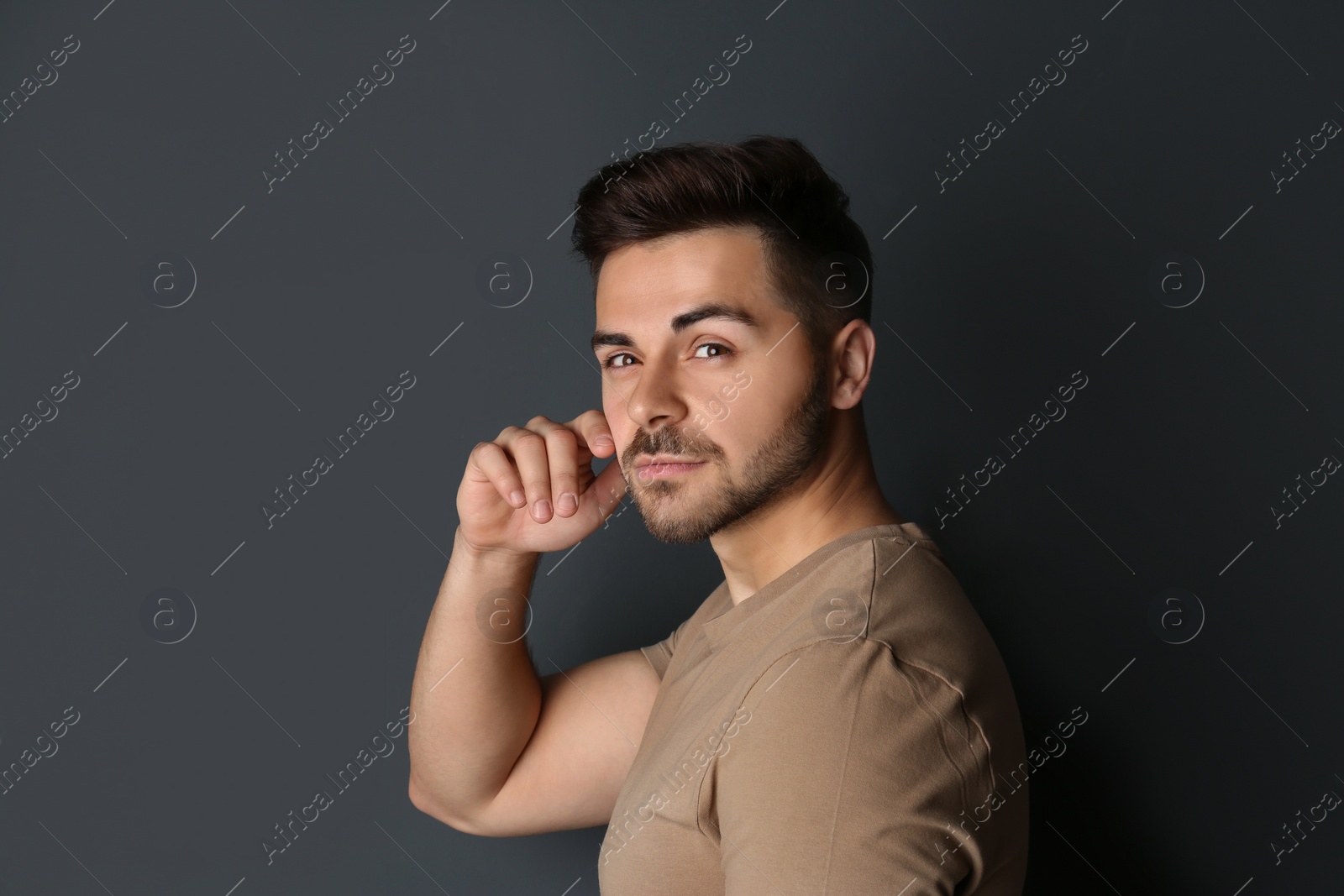 Photo of Portrait of handsome man on dark background