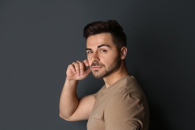 Portrait of handsome man on dark background