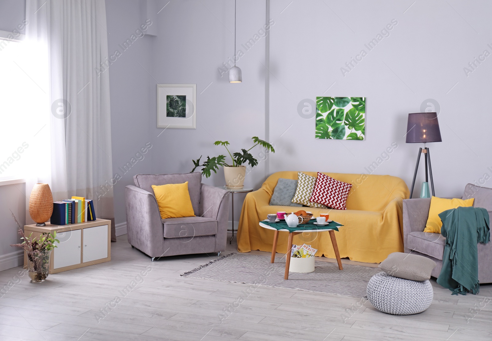 Photo of Elegant living room interior with cozy sofa and armchairs