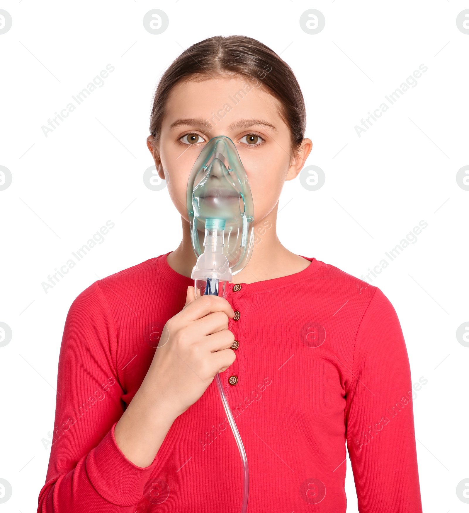 Photo of Cute girl using nebulizer for inhalation on white background