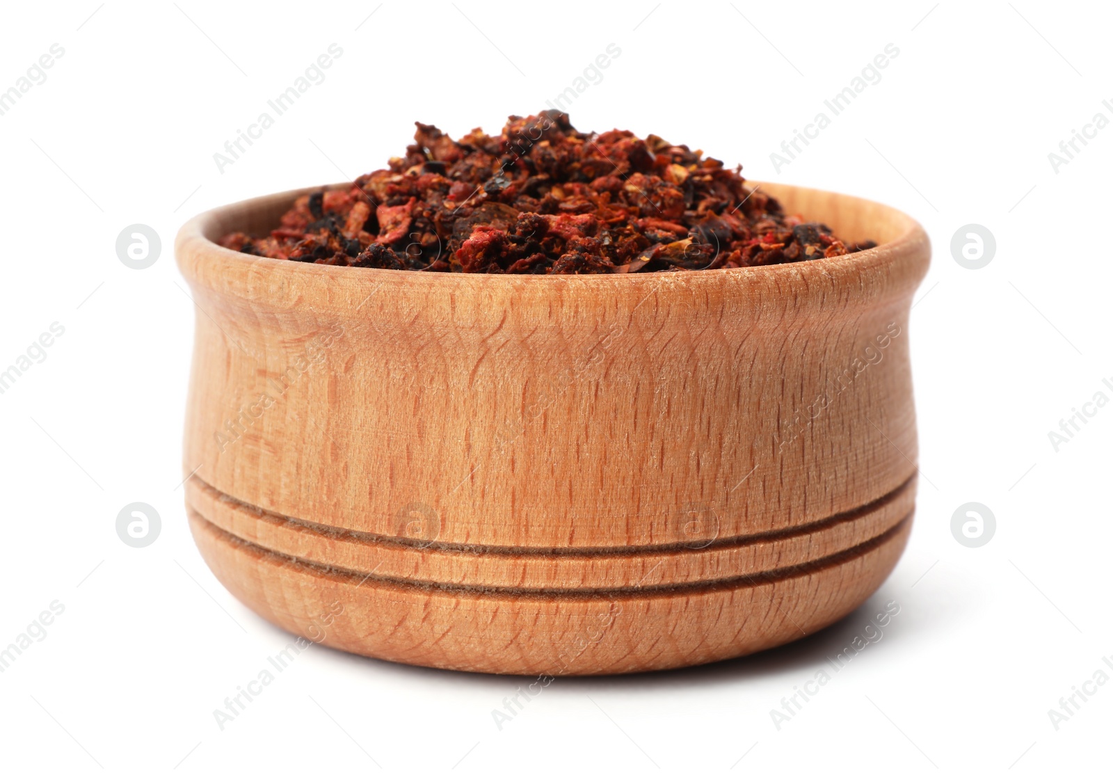 Photo of Wooden bowl with dried chili peppers on white background. Different spices