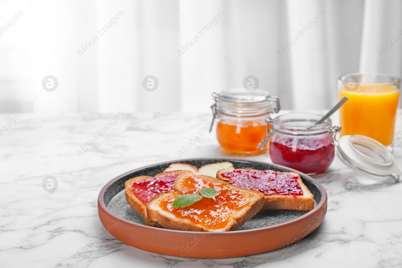 Photo of Toasts with jam on plate