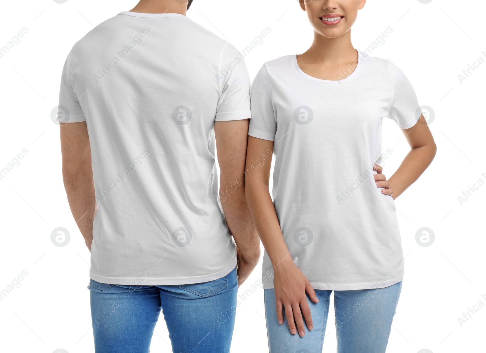 Photo of Young couple in t-shirts on white background. Mockup for design