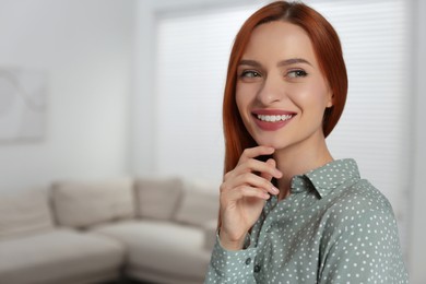 Photo of Portrait of beautiful young woman at home, space for text
