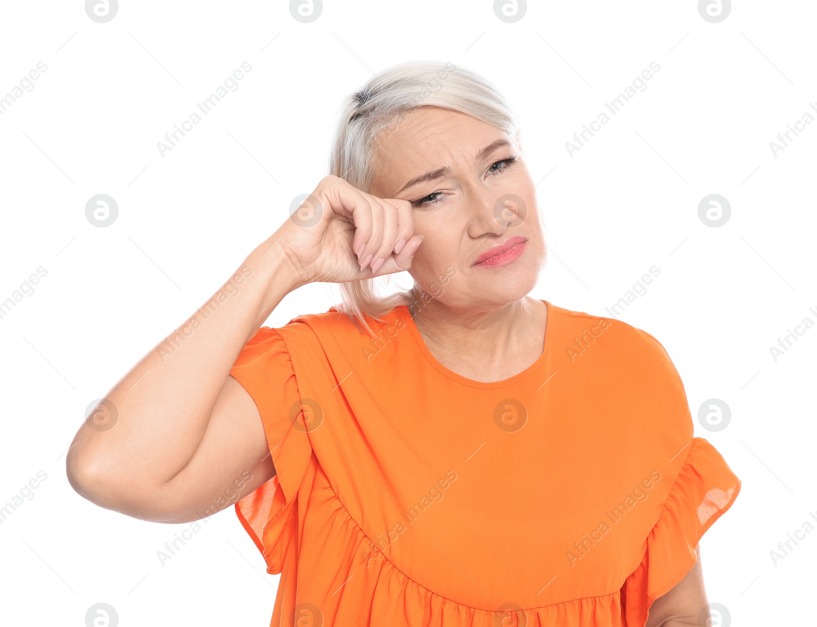 Photo of Mature woman rubbing eye on white background. Annoying itch