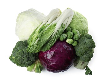 Photo of Many different types of fresh cabbage on white background, top view