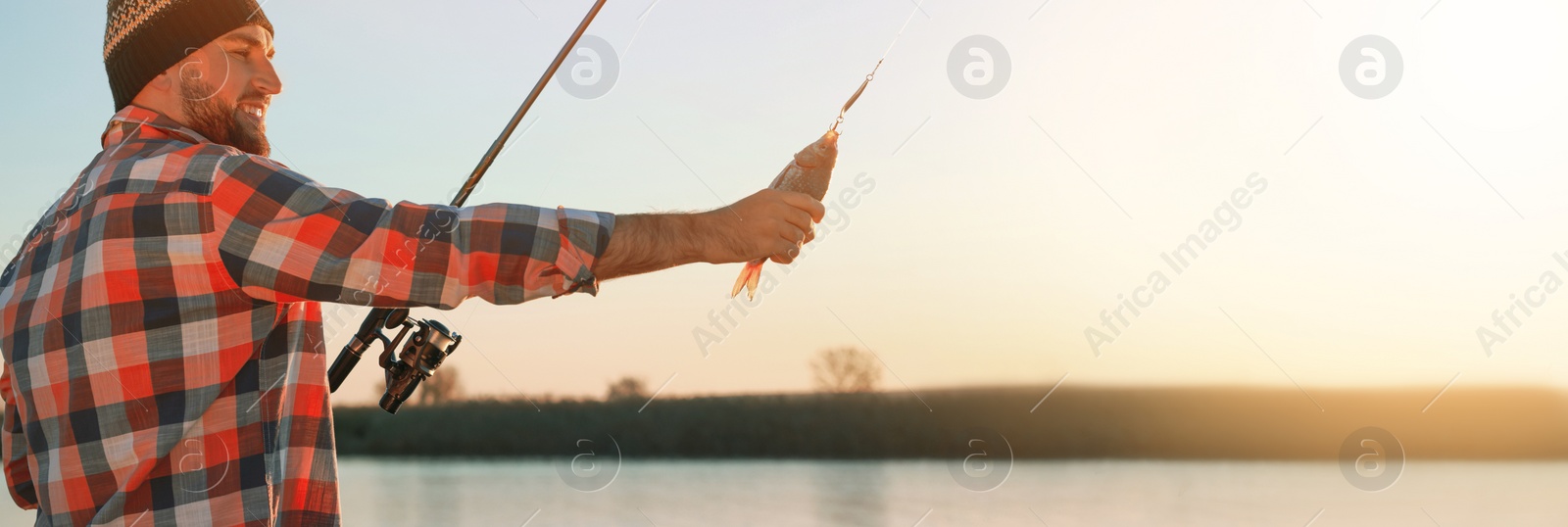 Image of Fisherman with rod and catch at riverside, space for text. Banner design