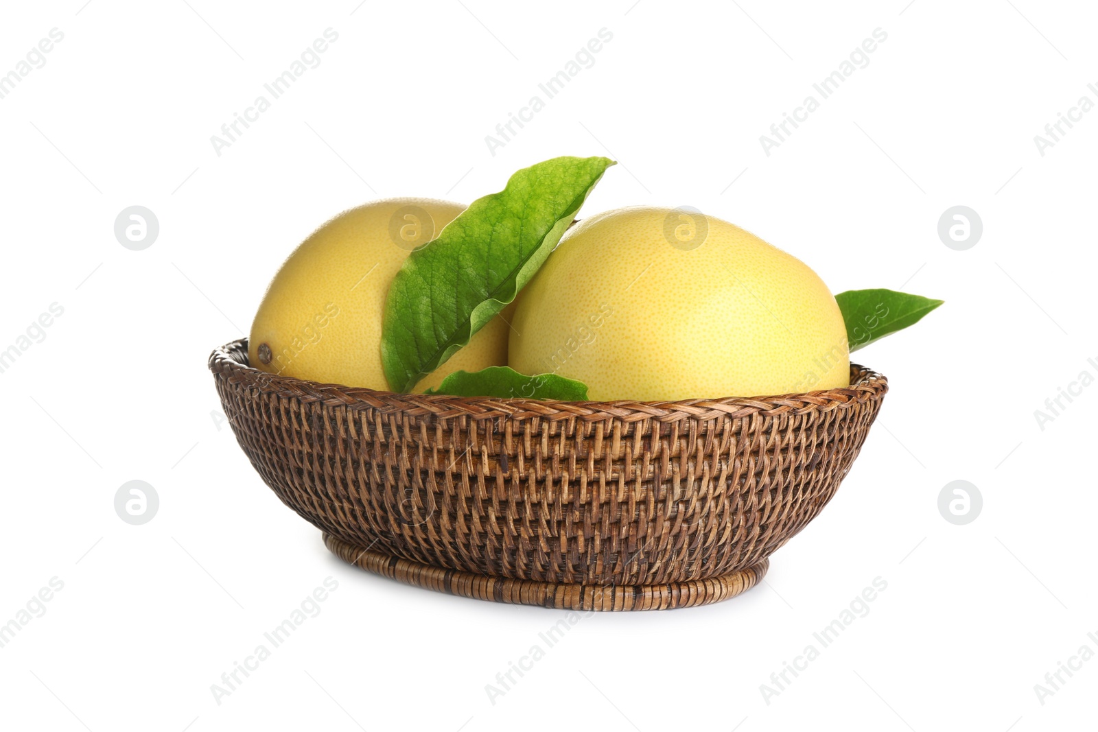 Photo of Wicker bowl with delicious pomelos isolated on white