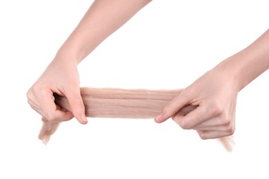 Photo of Woman holding beige felting wool on white background, closeup