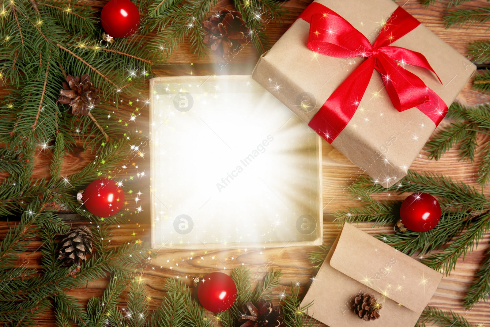 Image of Beautiful Christmas gift with magic light on wooden table, flat lay