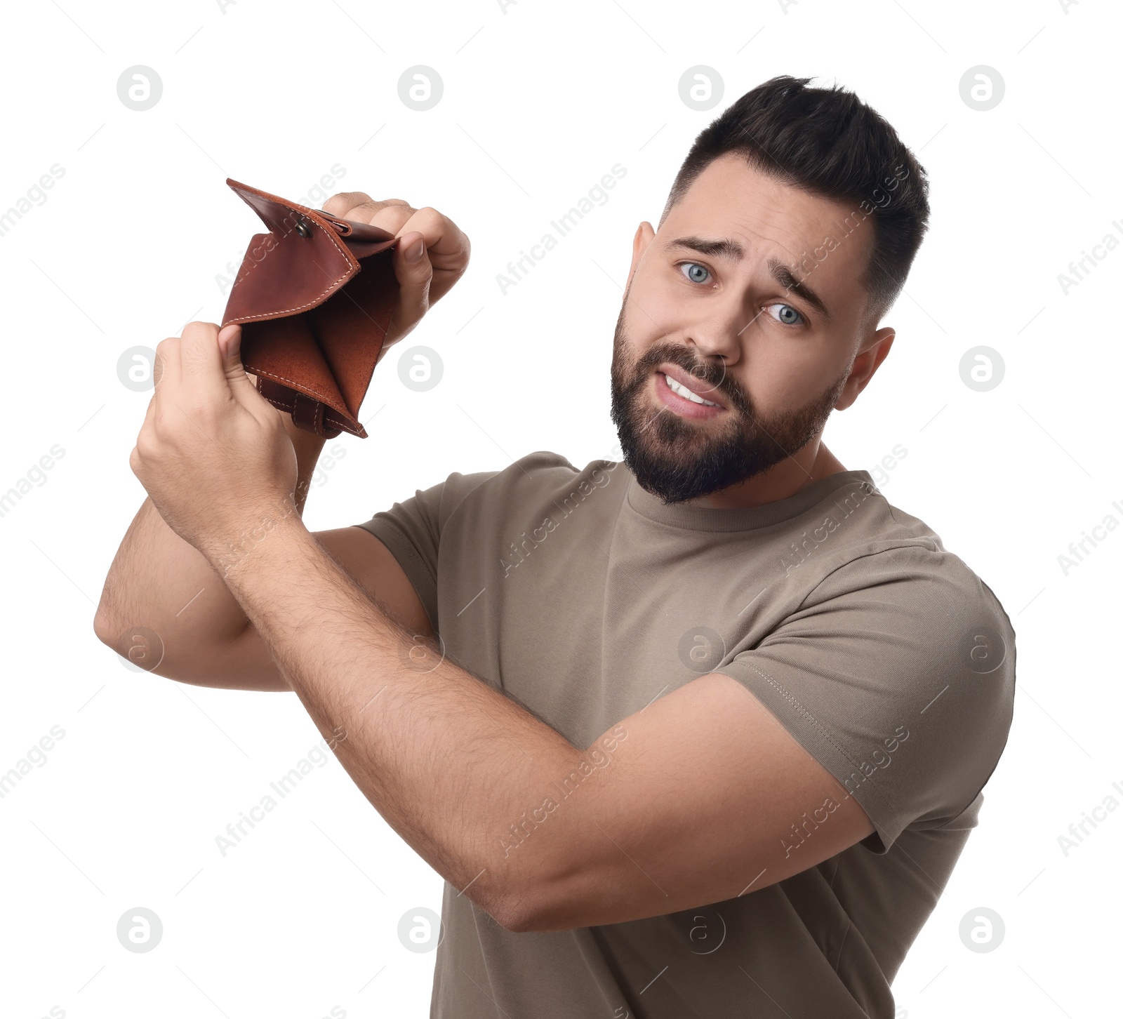 Photo of Upset man showing empty wallet on white background